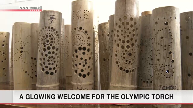Жители префектуры Мияги приготовили бамбуковые фонарики, чтобы приветствовать Олимпийский огонь