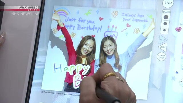 Фотокабины по-прежнему в центре внимания на выставке в Токио